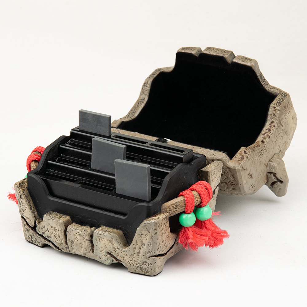 Open lid of ProtoX skull chest revealing custom storage slots for Nintendo Switch game cartridges.