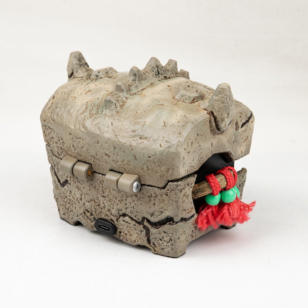 Back view of the rechargeable skull chest featuring a USB-C port for powering the LED eyes.