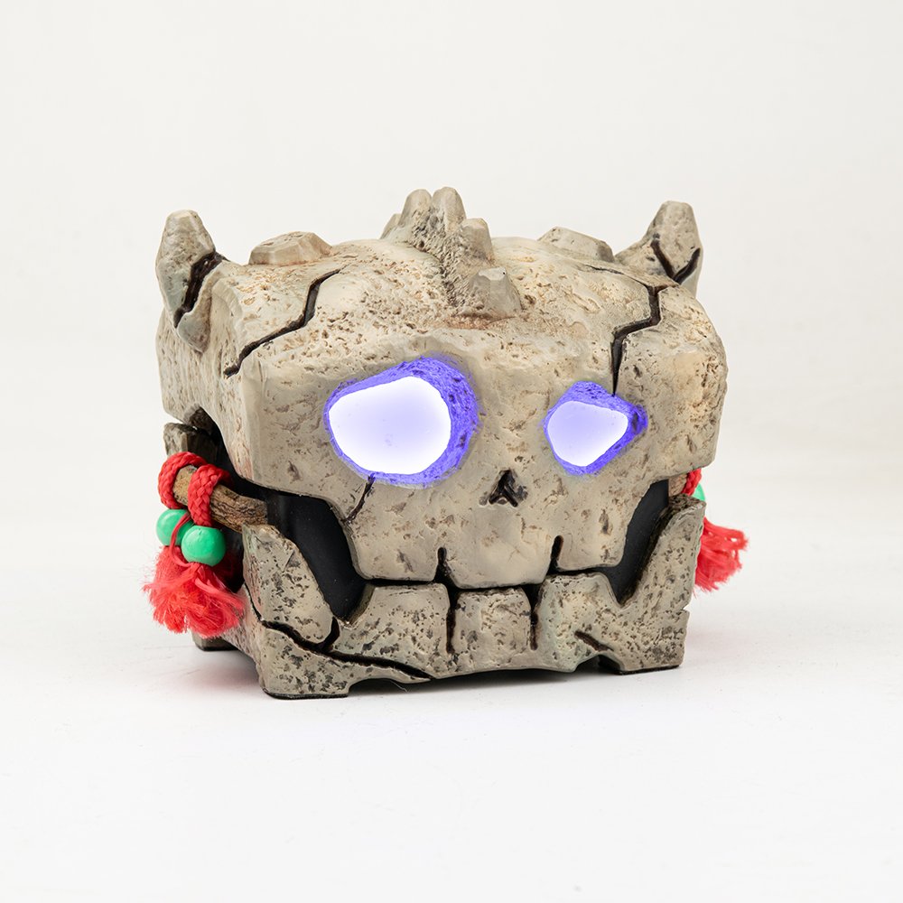 ProtoX Cursed Skull chest with purple LED eyes glowing in the dark, gaming setup decor.